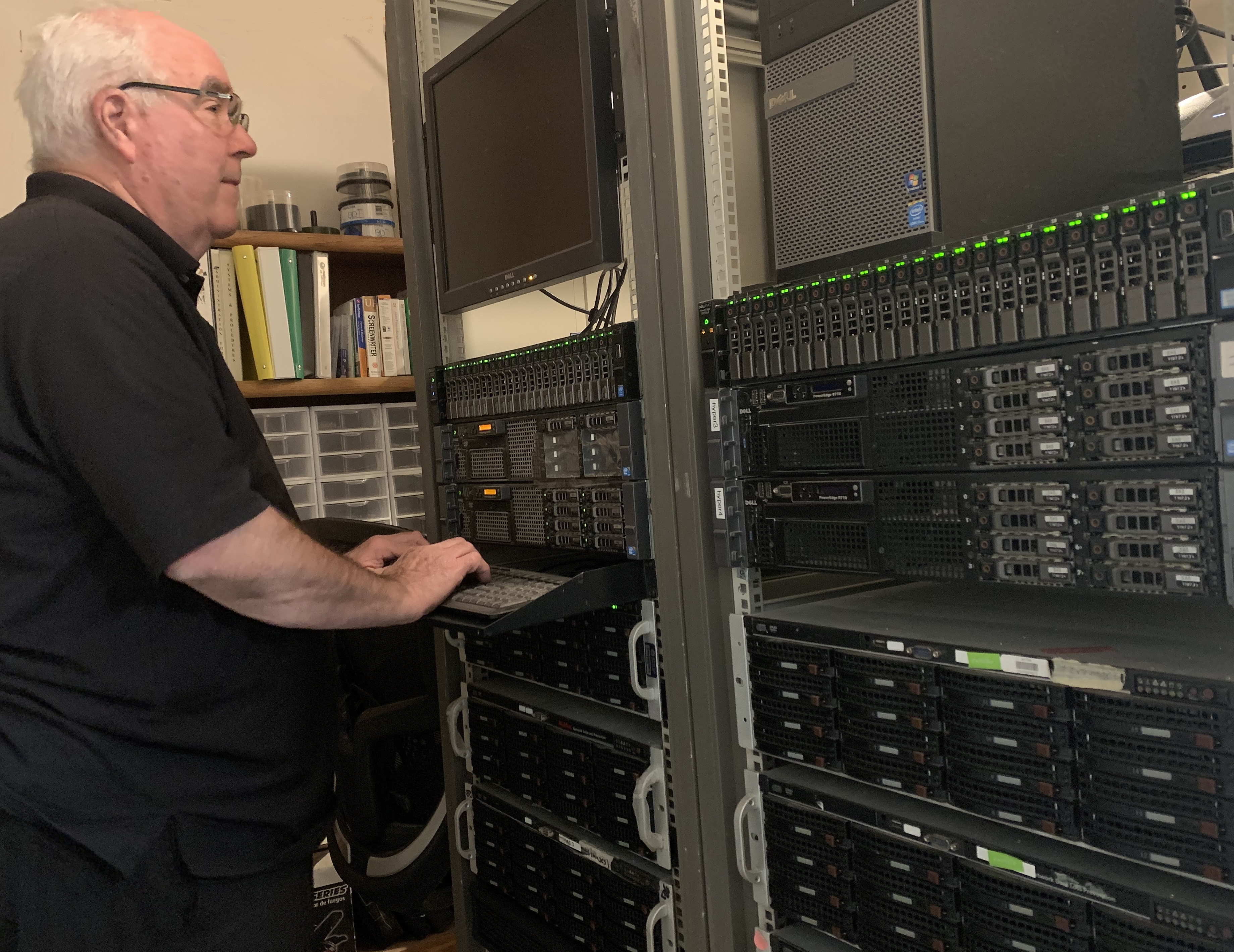 Don standing at the rack in his home server room